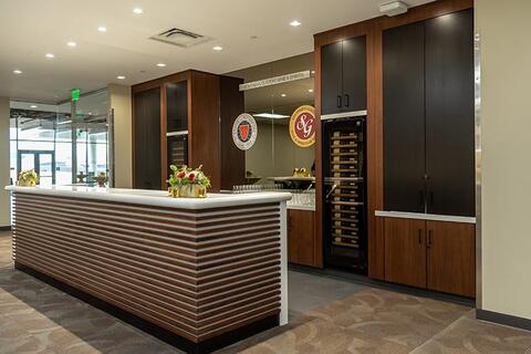 Simple bar top with wood accents and a wooden liquor cabinet