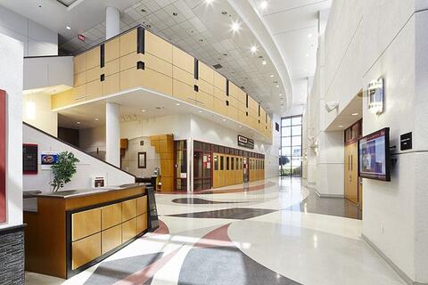 Lobby of the Stan Fulton Building, a large, open, white space with paths leading to different areas of the building