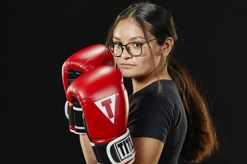 Woman posing with boxing gloves