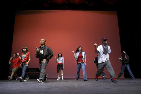A dance team performing on stage