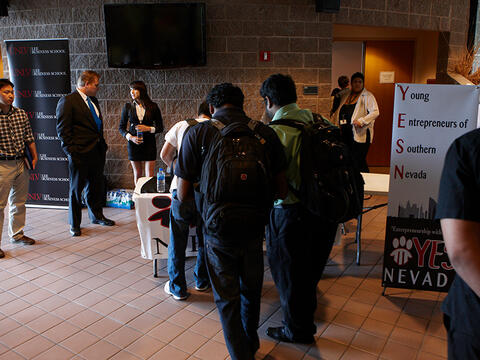 Students gathering around a booth