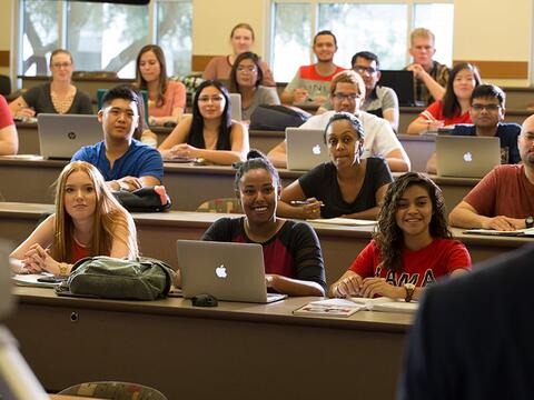 Students in class listening to a lecture.