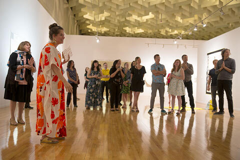 Alisha Kerlin addresses a group at the museum.