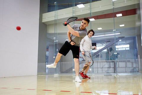 Group of people playing Squash