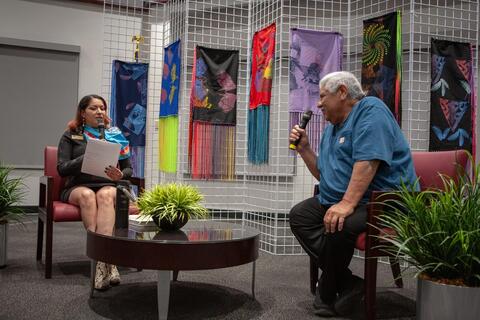 Woman interviewing man