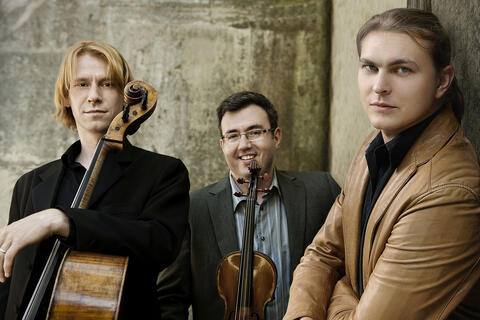 three men with instruments