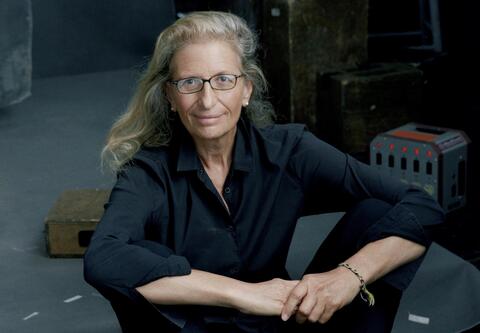 Annie Leibovitz seated on floor