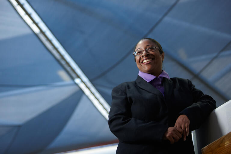 Karla Washington leaning against a wall