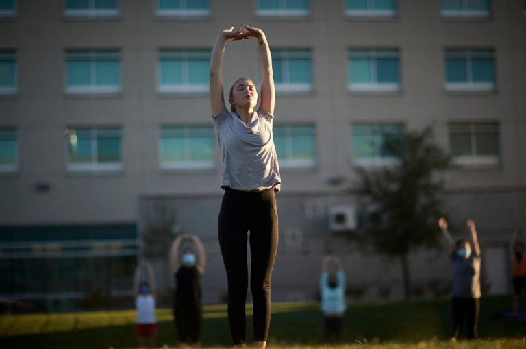 Woman stretching outside.