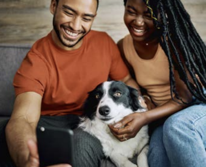 Two people with a dog