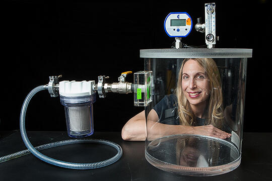 Barbara St. Pierre Schneider poses in her lab
