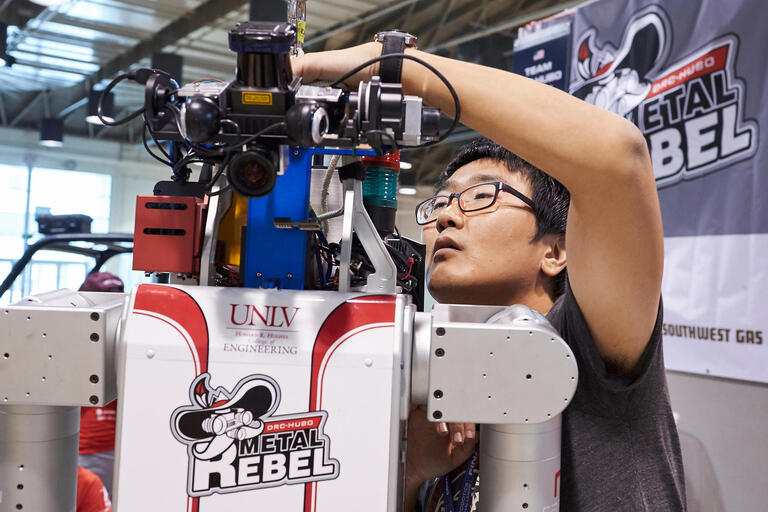 Kiwon Sohn makes a few adjustments to Metal Rebel before the start of the DARPA Robotics Challenge Finals.