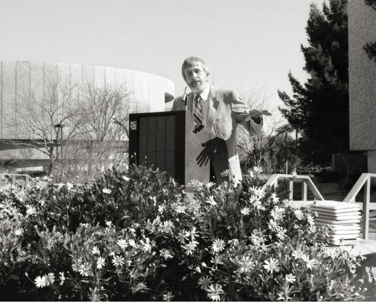 Donald Beapler speaking at a podium during the Xeric Garden dedication