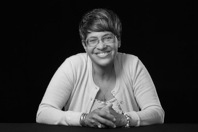 portrait of woman with hands folded