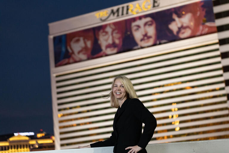 Woman poses in front of the Mirage casino