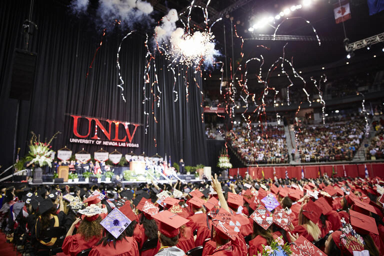 UNLV students in caps and gowns celebrating commencement
