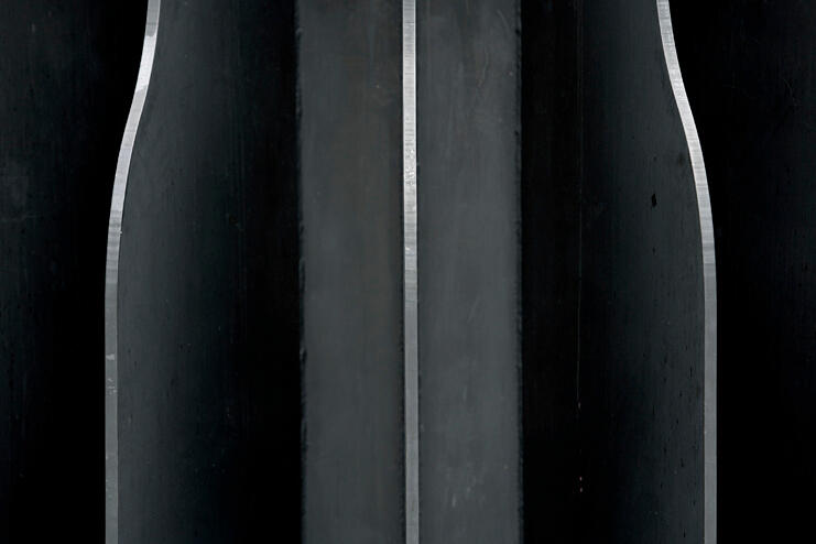 Detailed close up of a campus sculpture called the "Flashlight."