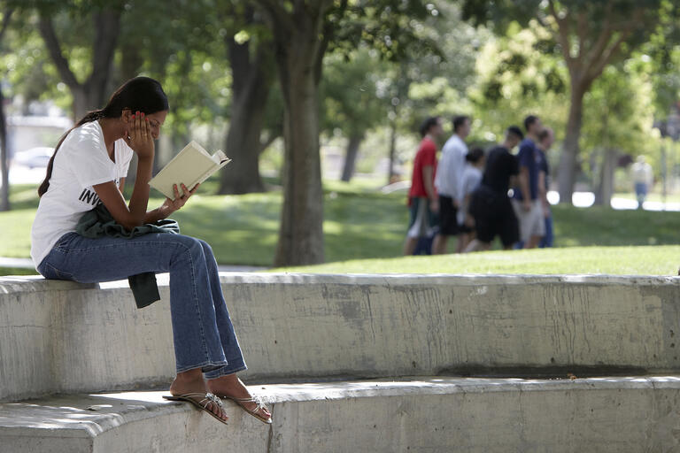 Student reads outside