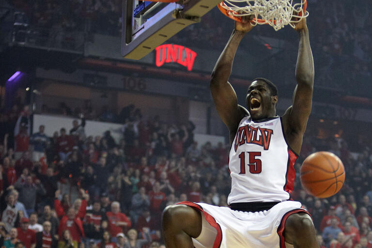 Anthony Bennett dunking a ball during a game.