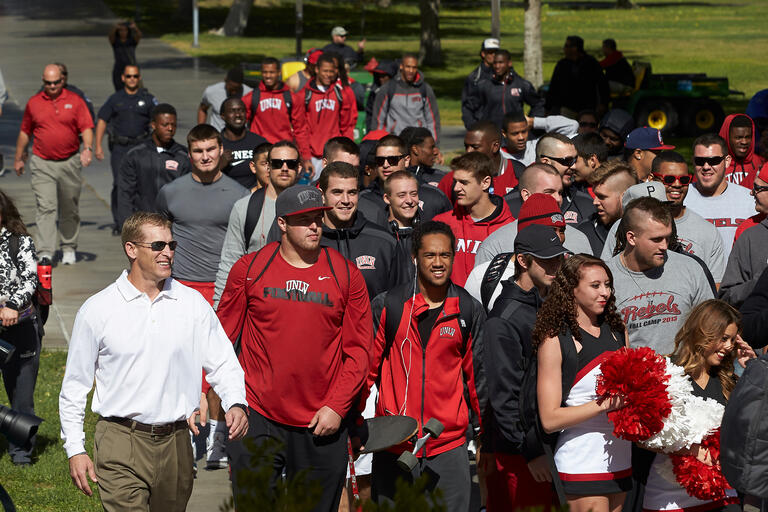 Group of student athletes walking together.