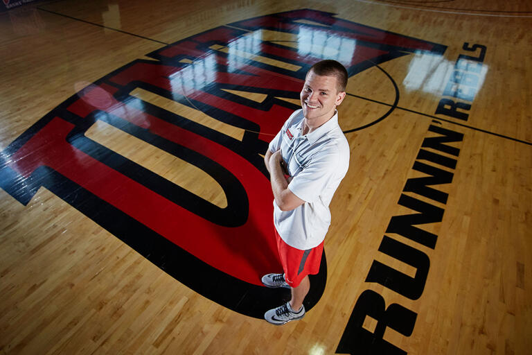 Preston Laird poses on basketball court