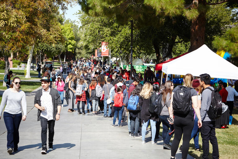 Students peruse booths at the 2017 homecoming carnival