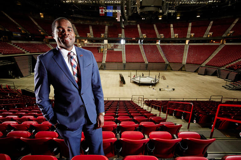 Marcus Bowman with the inside of the Thomas and Mack Arena behind him.