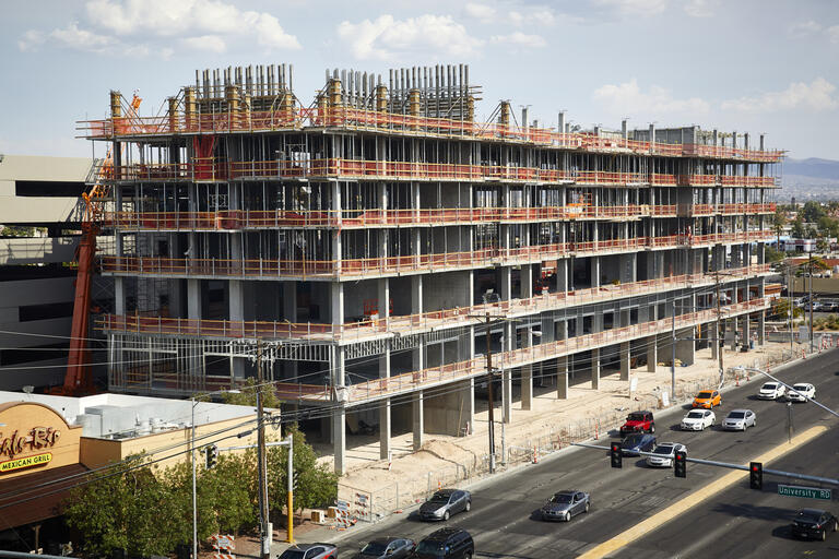 Concrete and steel rise into the sky as the University Gateway building is being constructed.