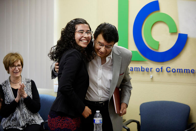 A man and woman embrace at the Latinx/UNLV meeting.