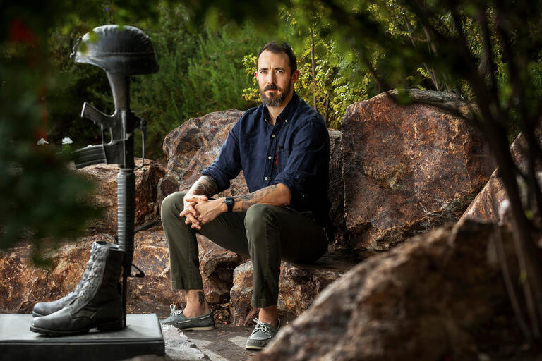 Nicholas Barr poses on UNLV's campus, his work focuses on homeless young adults and military service members.