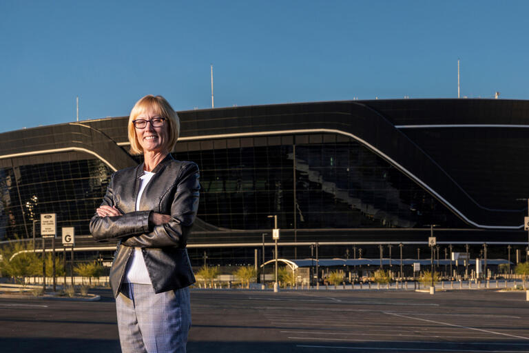 Professor Nancy Lough standing in front of Allegiant Stadium in Las Vegas