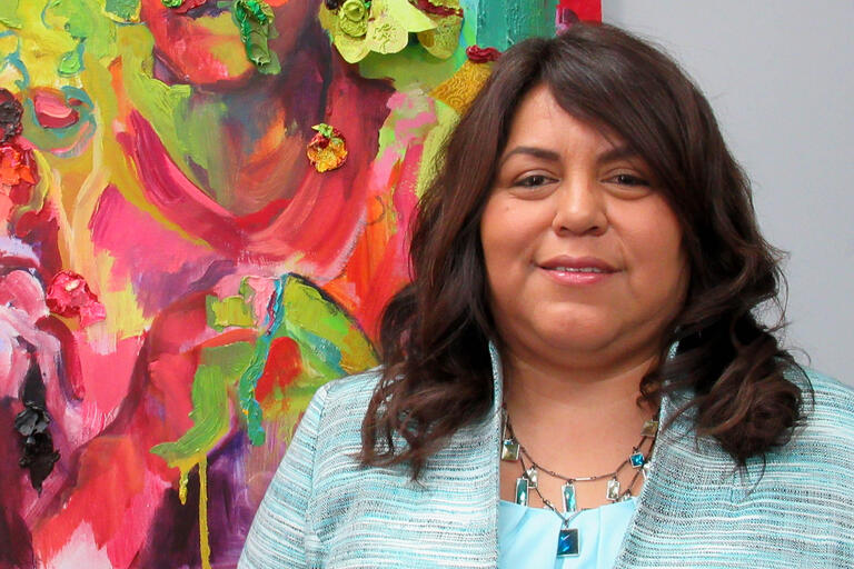 woman in front of artwork