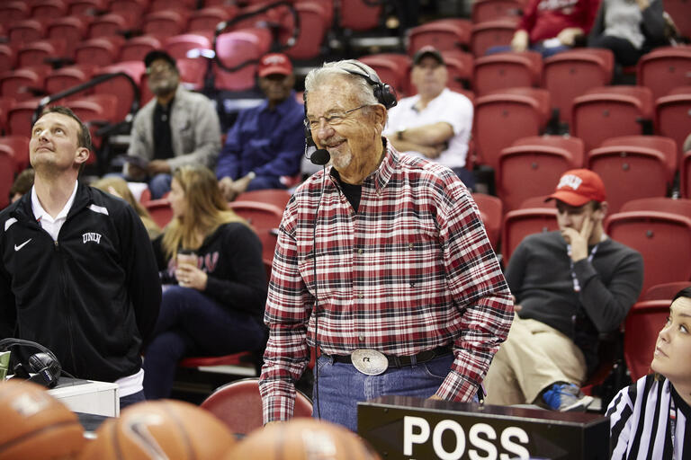 Dick Calvert at a stadium standing in the seats