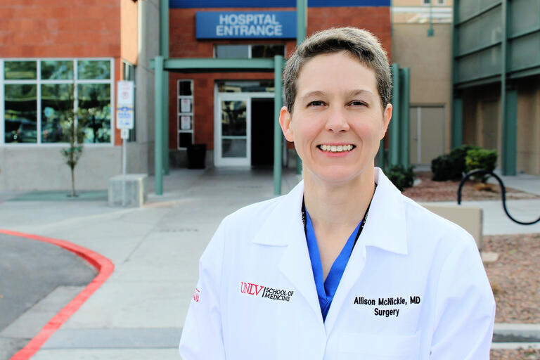 doctor in front of ER entrance