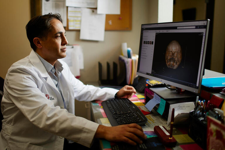 Dr. John Menezes reviews an x-ray
