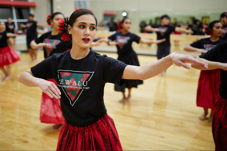 A woman practices Hawaiian dance