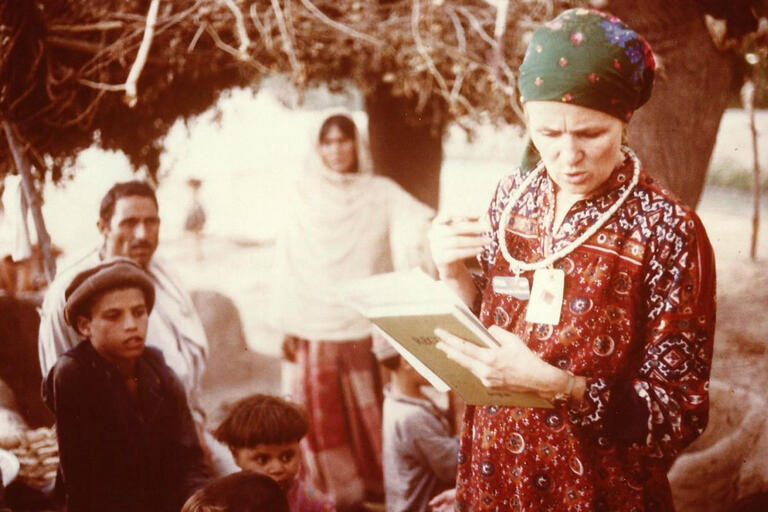 Mary Guinan, in traditional dress in an Afghan refugee camp