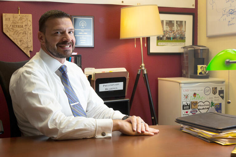 man in white shirt and tie at desk