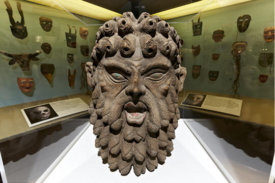 A mask with the background filled with a display of masks