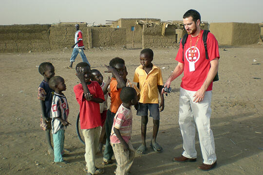 Eric Talbert with a group of children