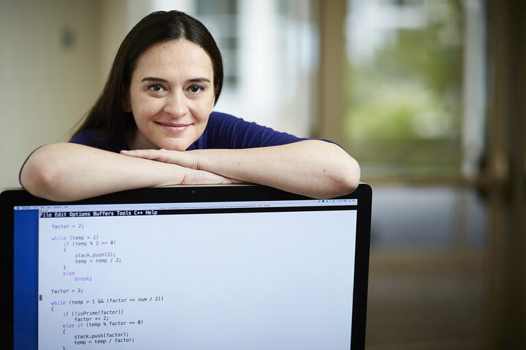 woman behind computer terminal