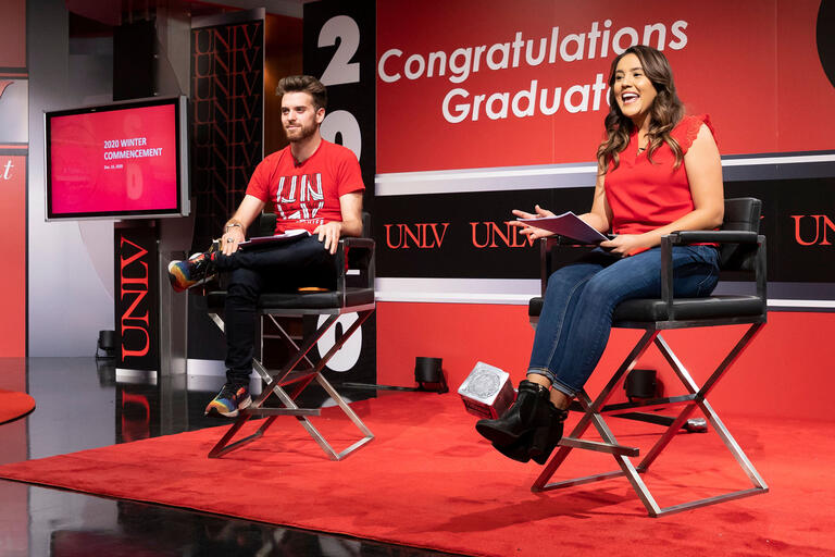 man and woman on tv set