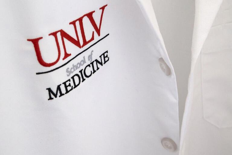 white coat with UNLV School of Medicine logo