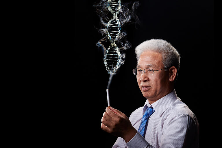 Xiangning Chen holds a cigarette with smoke resembling a DNA strand