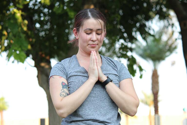 Carly Chang holdings in prayer position