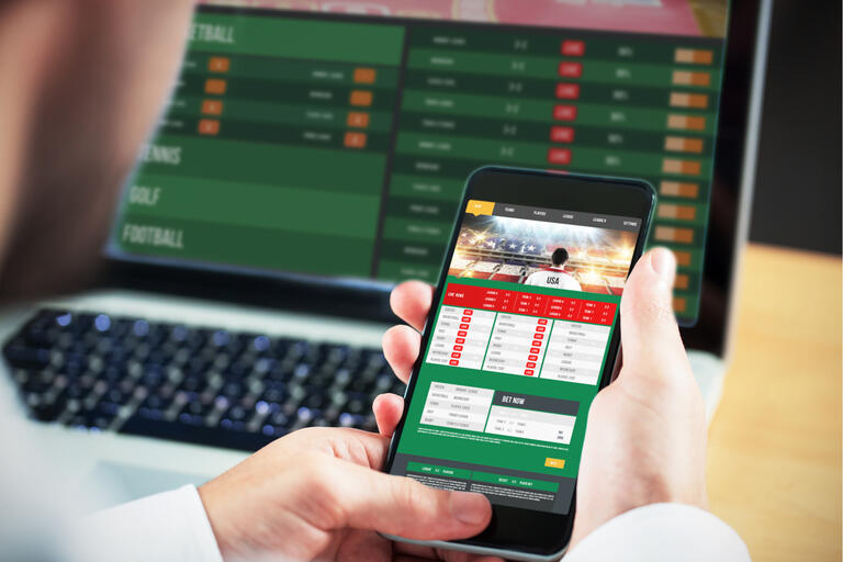 computer screen and smartphone on gambling website
