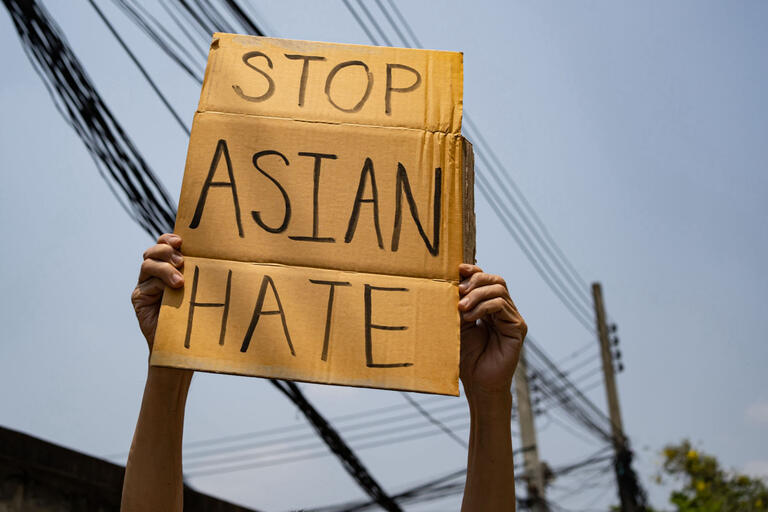 handwritten sign saying &quot;Stop Asian Hate&quot;