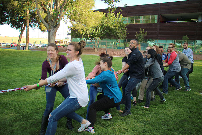 The UNLV School of Medicine Charter Class having a Tug of War competition