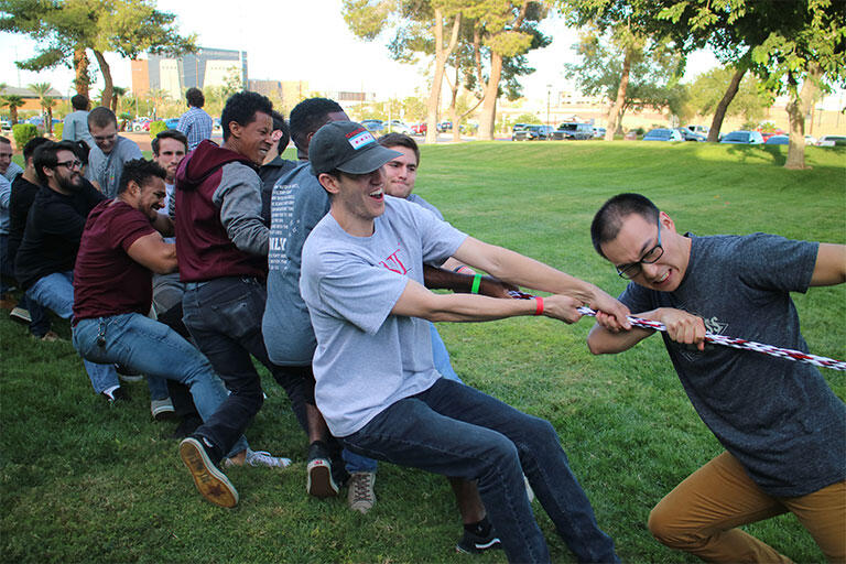 The UNLV School of Medicine Charter Class having a Tug of War competition