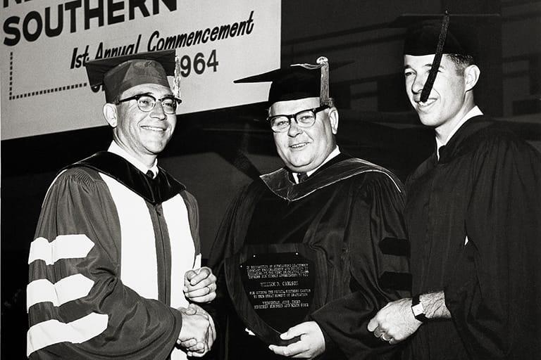 U-N-L-V first graduate, John Cobain, at the first commencement ceremony